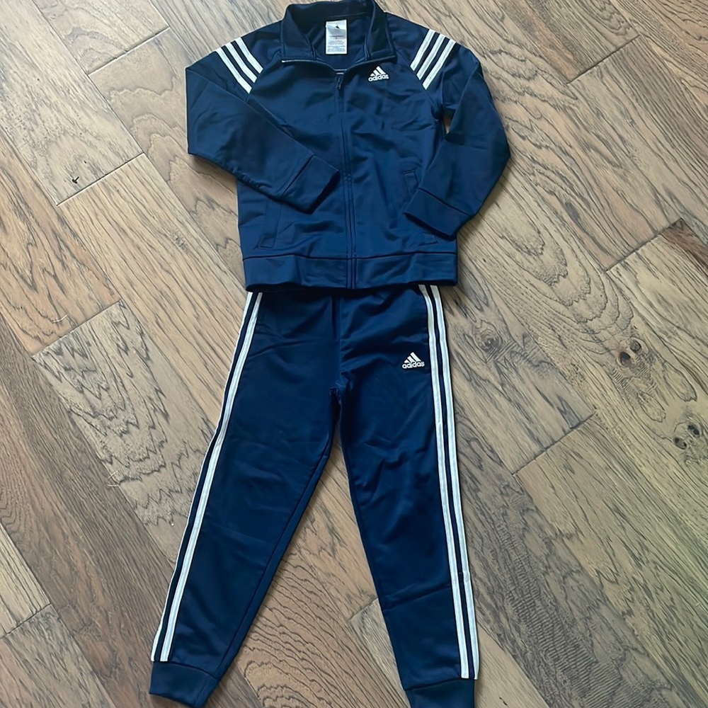 Adidas track suit.